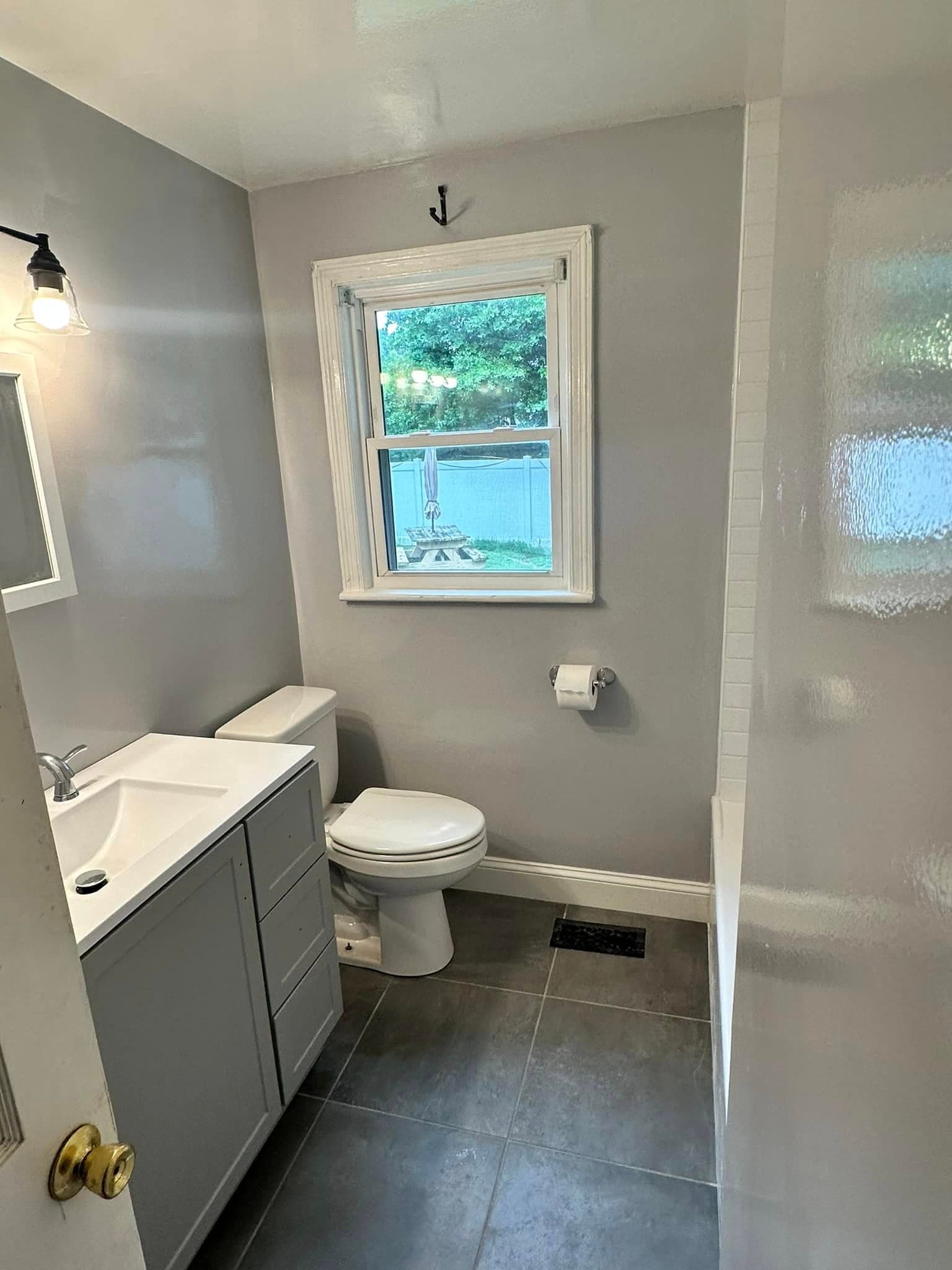 Finished bathroom remodel completed by Newman's Plumbing in a historic-style Ghent, Norfolk, VA home