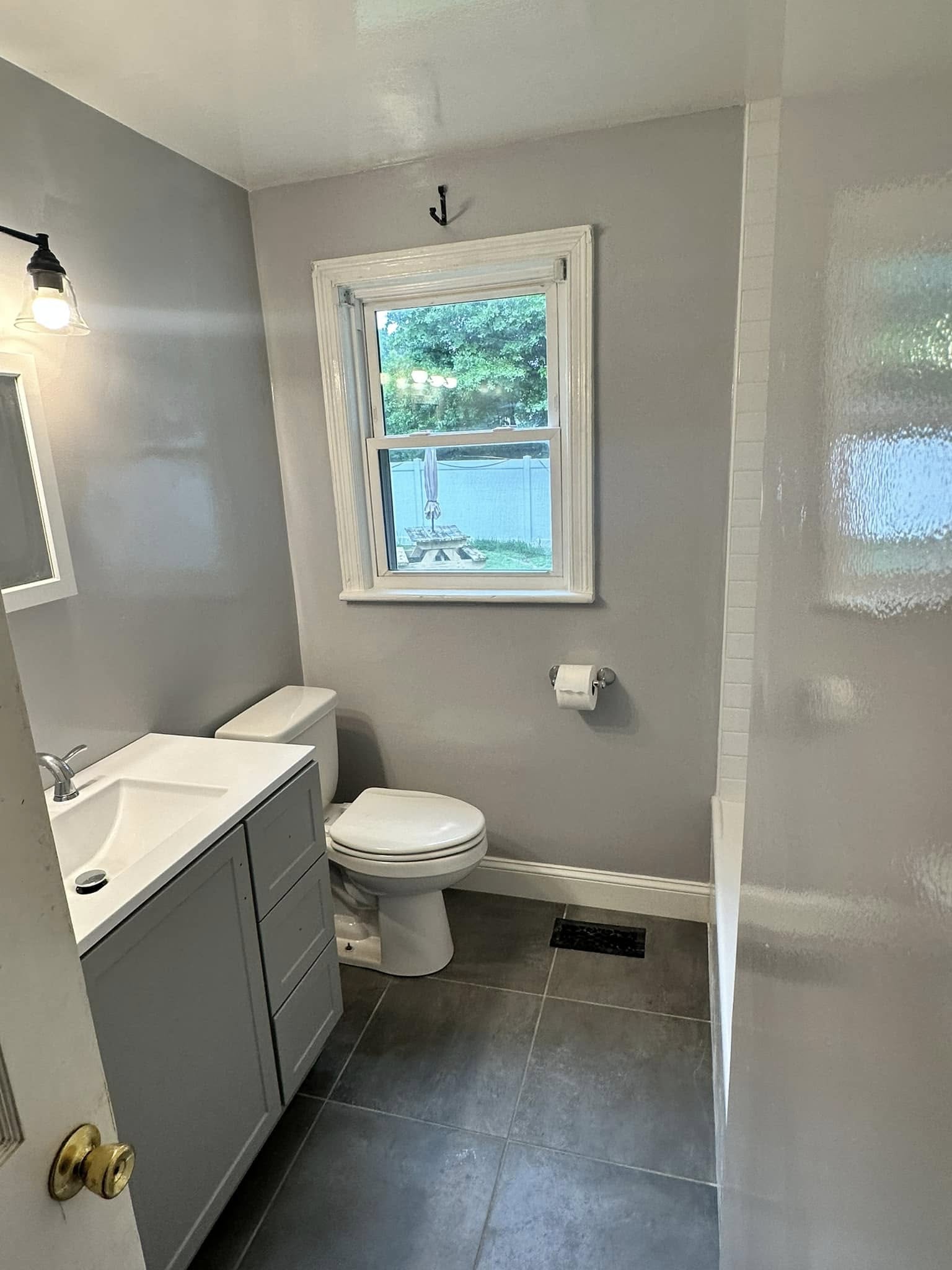 Finished bathroom remodel completed by Newman's Plumbing in a historic-style Ghent, Norfolk, VA home