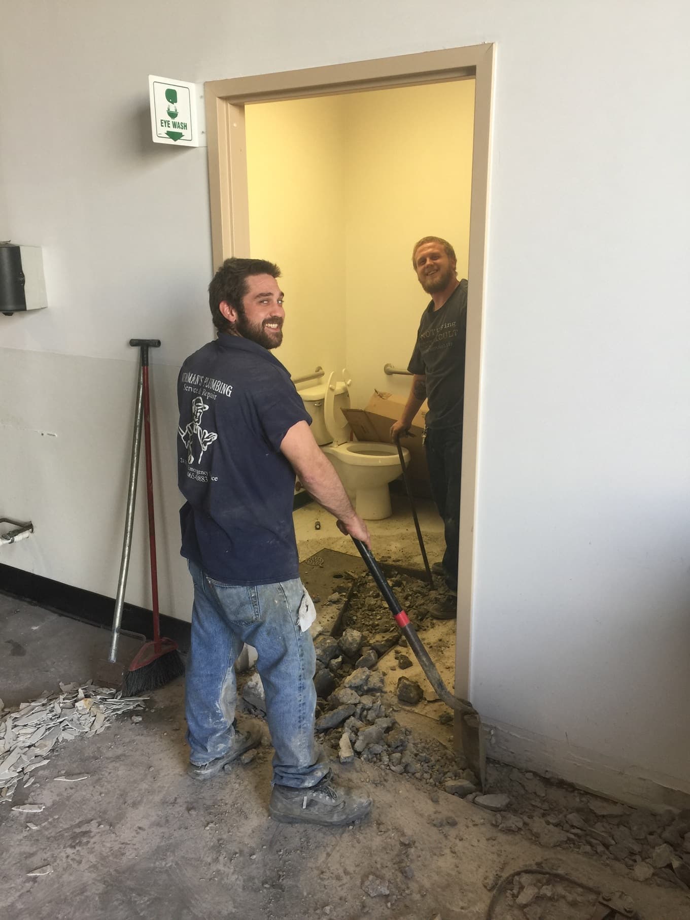 Smiling Newman's Plumbing technicians on the job in Portsmouth, VA