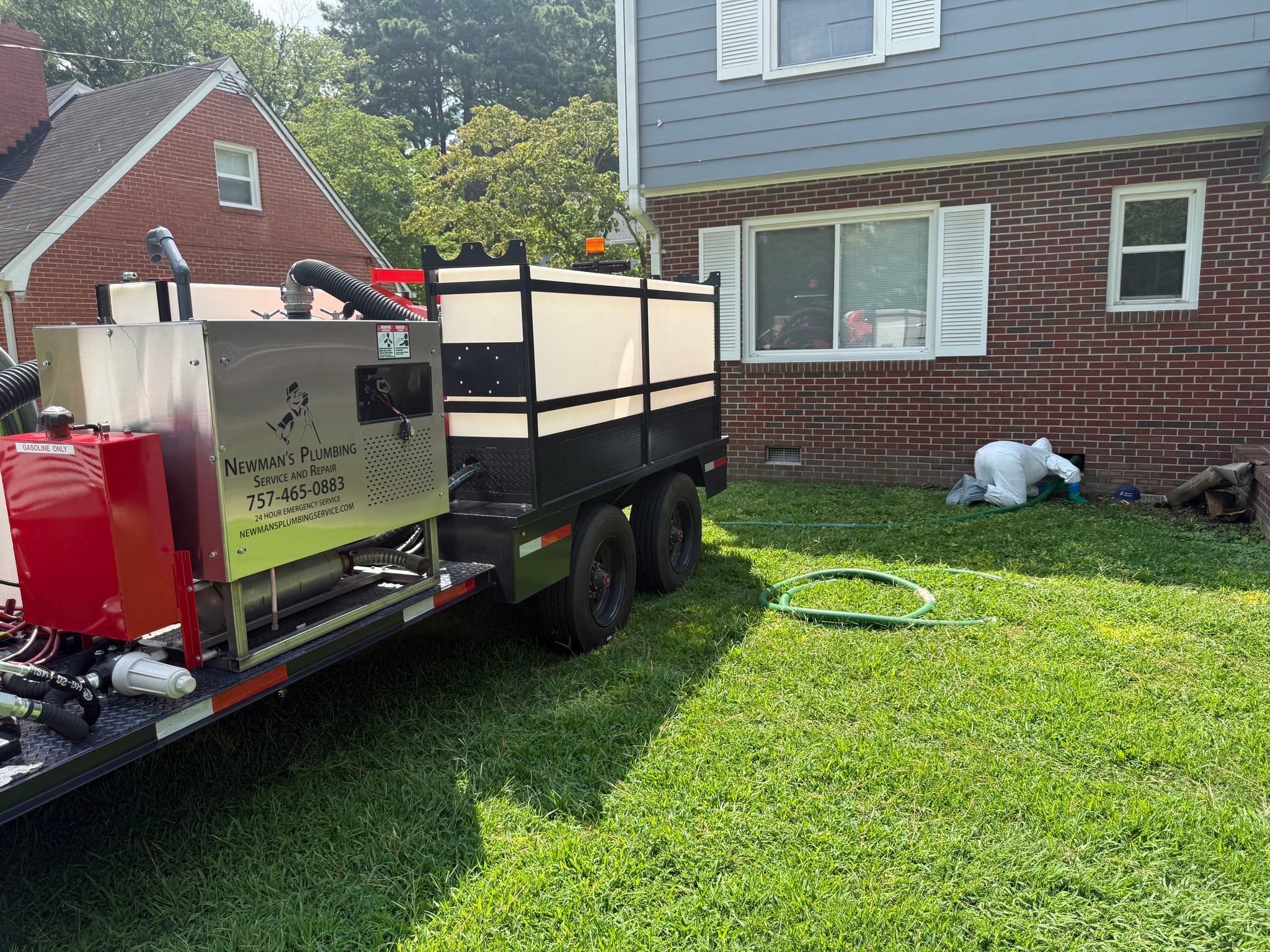 Newman's Plumbing vacuum trailer set up for an emergency call at a Portsmouth, VA home